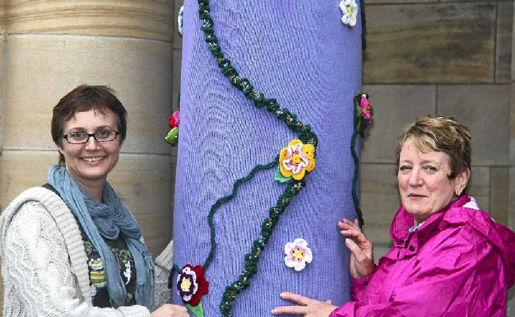 Art gallery assistant Loretta Grayson and Jumpers and Jazz volunteer Fran Hockings put the final touches on the Town Hall in the rain yesterday afternoon. Art gallery assistant Loretta Grayson and Jumpers and Jazz volunteer Fran Hockings put the final touches on the Town Hall in the rain yesterday afternoon.